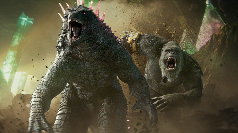 Godzilla and King Kong running into battle alongside one another in Godzilla x Kong: The New Empire