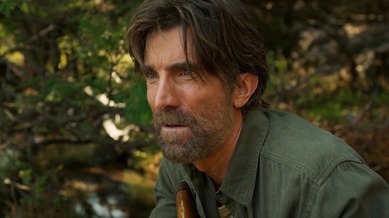 Sharlto Copley stares afraid