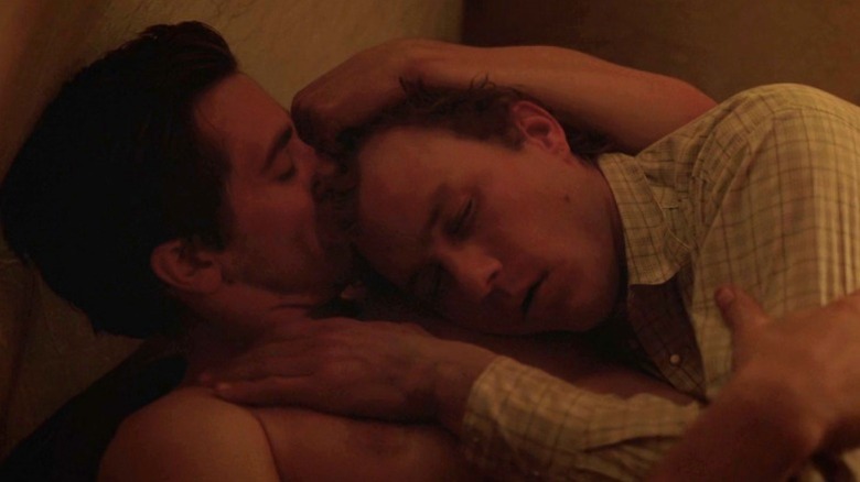 Jake Gyllenhaal as Jack Twist kissing the head of Heath Ledger as Ennis Del Mar in Brokeback Mountain