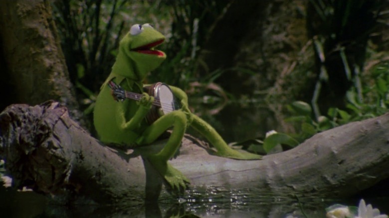 The Muppet Movie's Kermit the Frog playing banjo and singing in a swamp