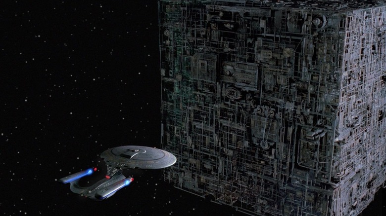 The U.S.S. Enterprise-D facing off against a Borg cube.