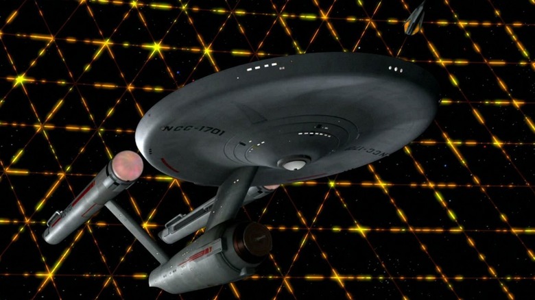 The U.S.S. Enterprise being trapped in the Tholian web