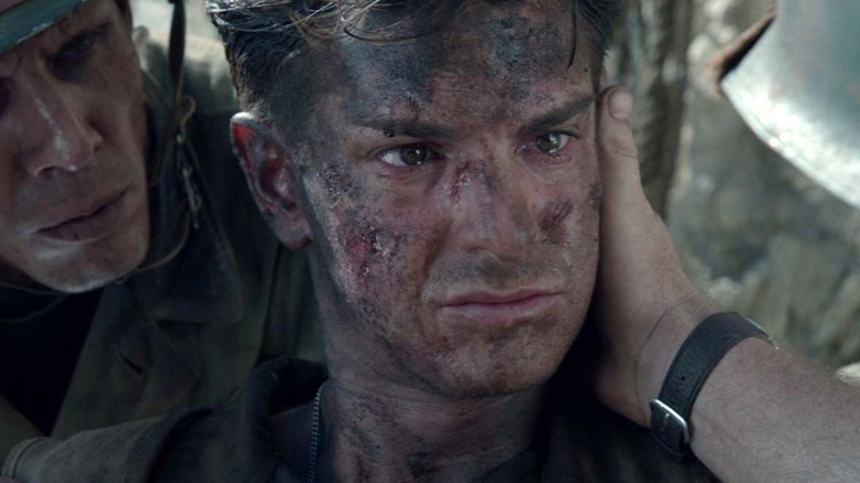 Andrew Garfield as Desmond Doss looks dirty and traumatized in Hacksaw Ridge