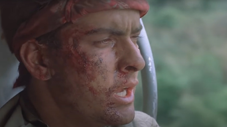 Charlie Sheen as Chris Taylor looks exhausted in Platoon