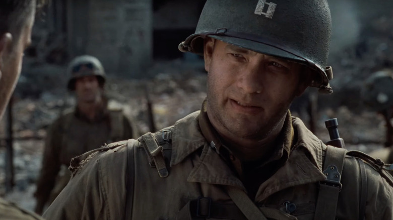 Tom Hanks as Captain John Miller talks to a soldier in Saving Private Ryan