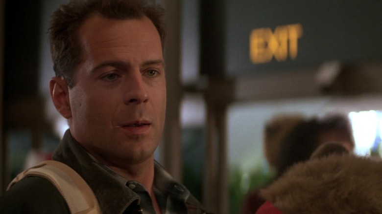 Bruce Willis' John sits in what seems to be an airport in Die Hard