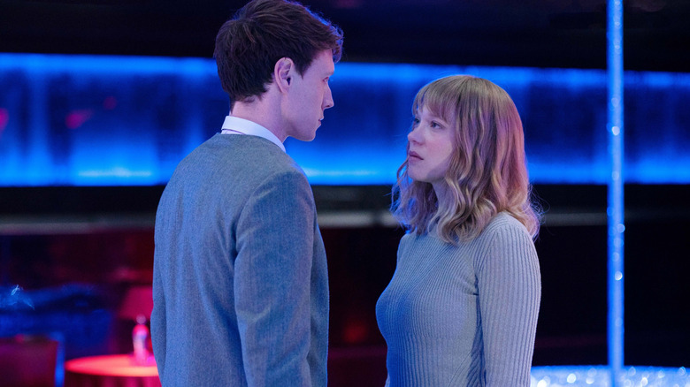 Léa Seydoux as Gabrielle and George MacKay as Louis in a neon-lit, futuristic setting in The Beast