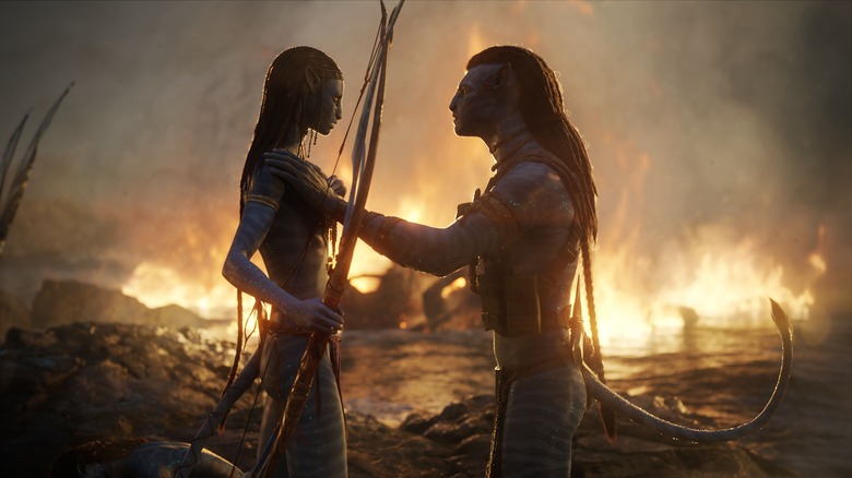 Jake and Neytiri talking in front of fire Avatar: The Way of Water