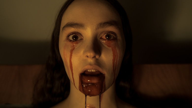 Lily-Rose Depp as Ellen bleeds from her eyes and mouth in Nosferatu