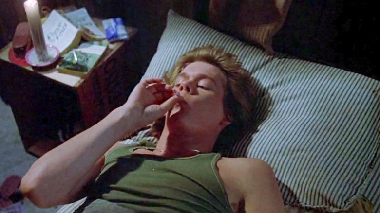 Kevin Bacon smokes in bed in Friday the 13th