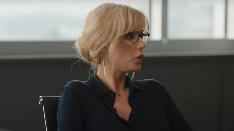 Beth Dutton sitting in a boardroom in Yellowstone