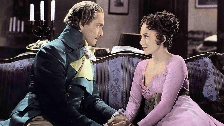 Anthony (Fredric March) staring at Angela (Olivia de Havilland) in Anthony Adverse