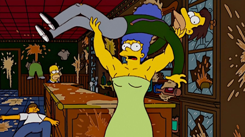 Roided-out Marge holding Lenny in the air on The Simpsons