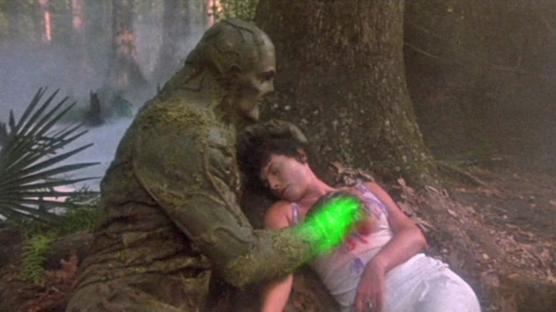 Dick Durock as Swamp Thing heals Adrienne Barbeau's Alice Cable.