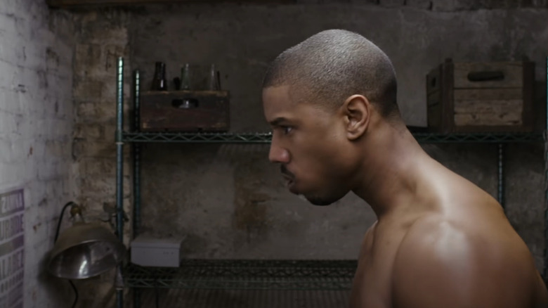 Michael B. Jordan as Adonis Creed training shirtless