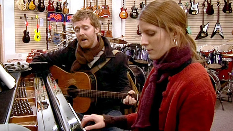 Guy (Glen Hansard) and Girl (Markéta Irglová) play a song in a music store in Once