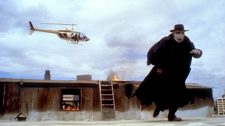 Darkman fleeing a gunman in a helicopter
