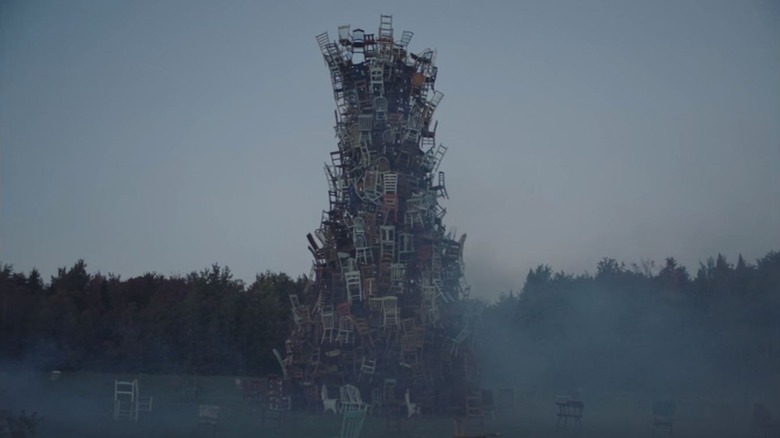 Zombies stack household objects in an ominous pile.