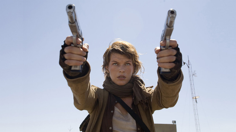 Milla Jovovich's Alice takes aim with two handguns.