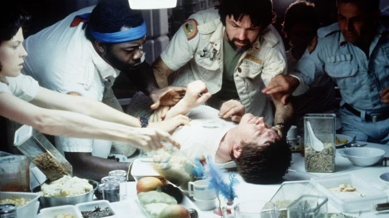 The Nostromo crew help Kane