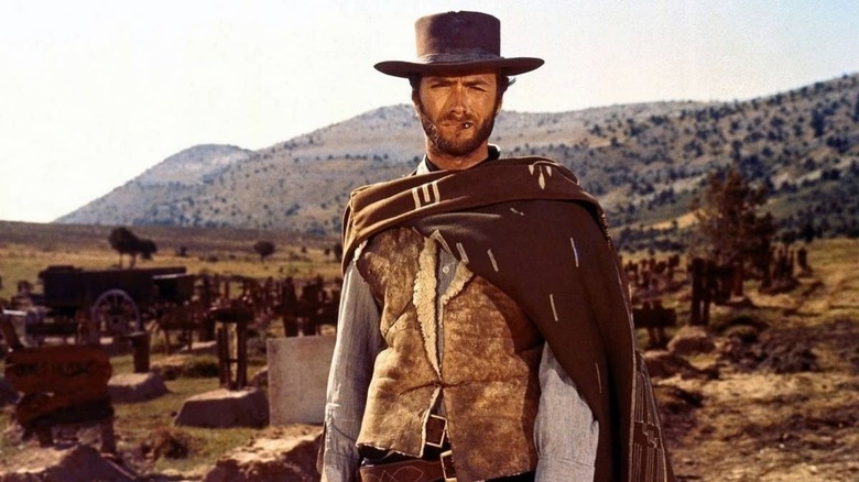 Clint Eastwood smokes a cigar in A Fistful of Dollars 