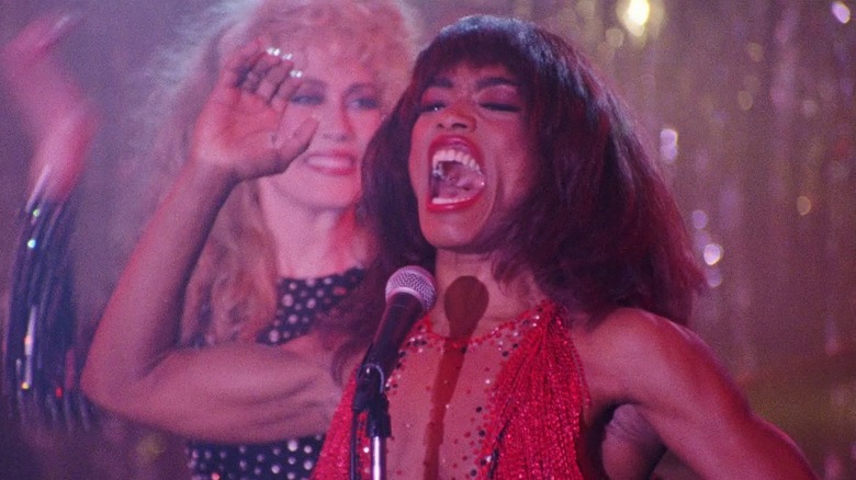 Angela Bassett as Tina Turner singing on stage