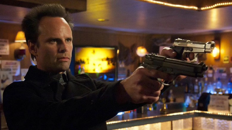 Walton Goggins bar guns