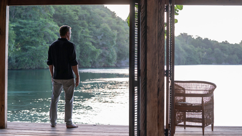 Bond looks out at the water