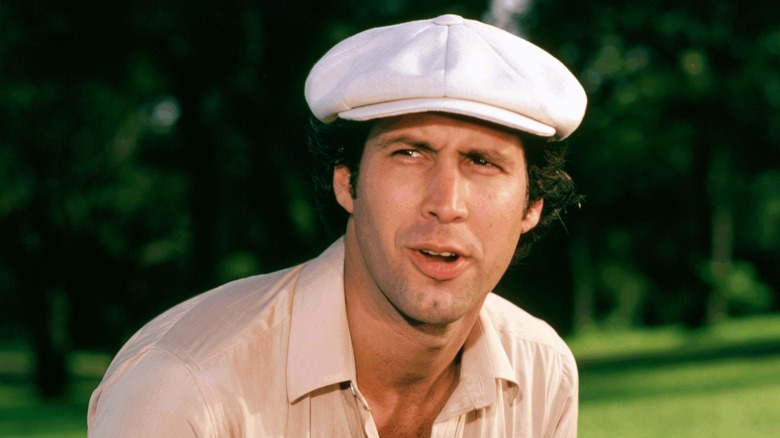 Chevy Chase in golf hat