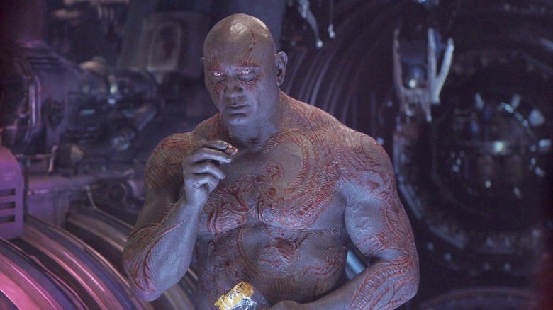 Drax eating a snack on a ship