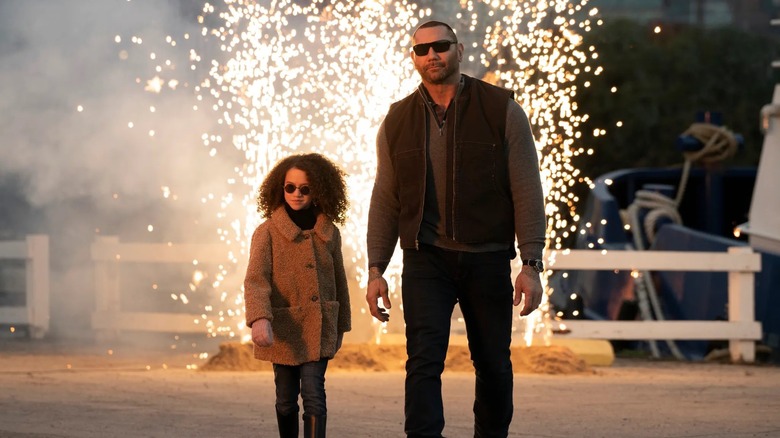 Sophie and JJ walking away from fireworks