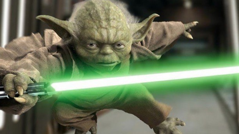 Yoda attacks green lightsaber