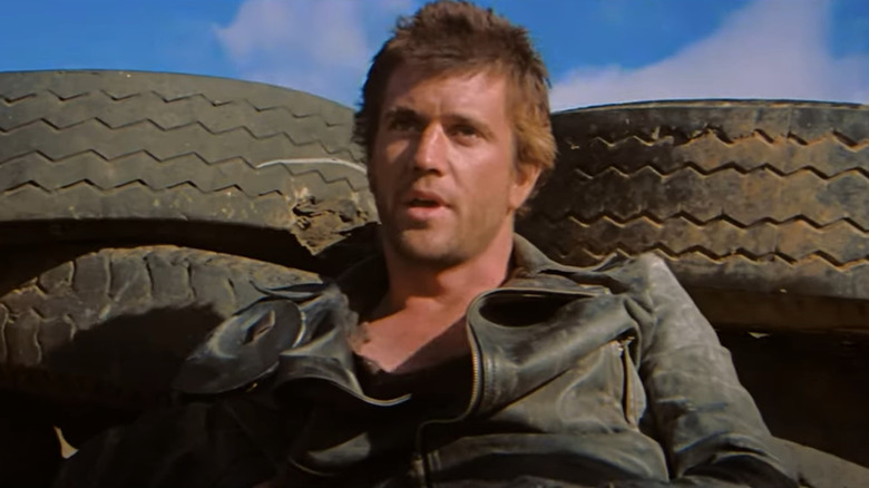 Mel Gibson as "mad" Max takes cover in The Road Warrior