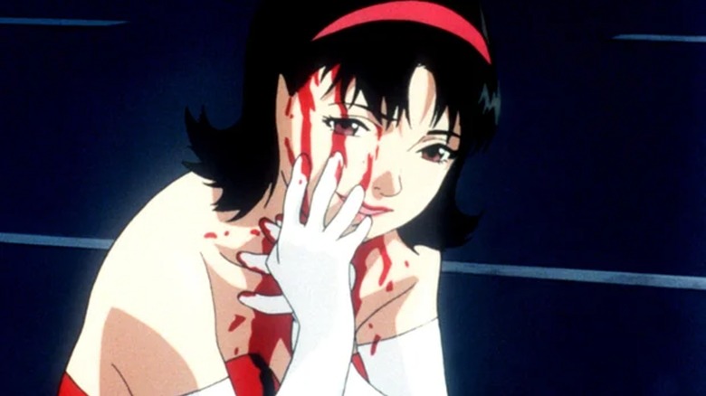 A bloodied Mima touching her face in Perfect Blue