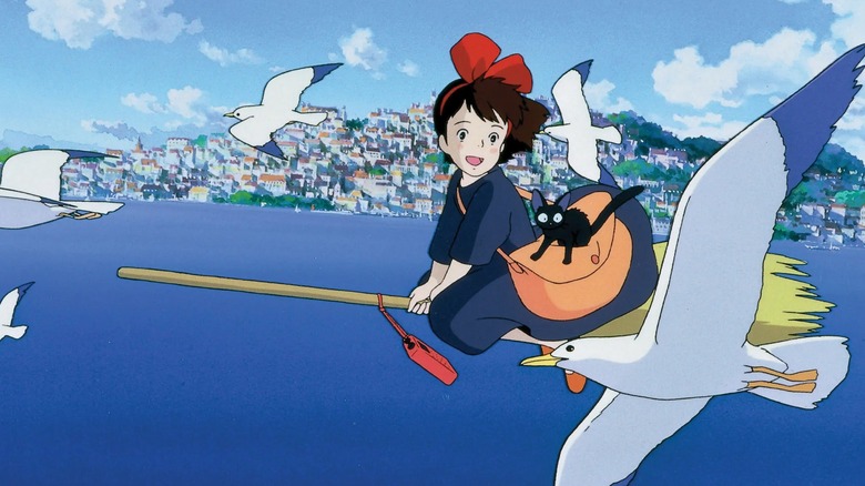 Kiki flying on her broom with Jiji in Kiki's Delivery Service