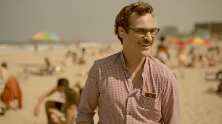 Theodore smiles on a beach in Her