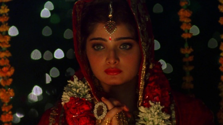 Aditi in festive clothes with a stern expression on her face in Monsoon Wedding