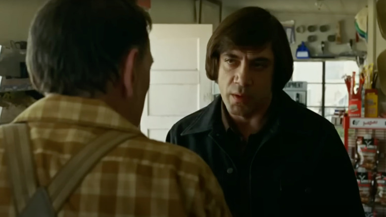 Javier Bardem as Anton Chigurh stares down a victim in No Country for Old Men