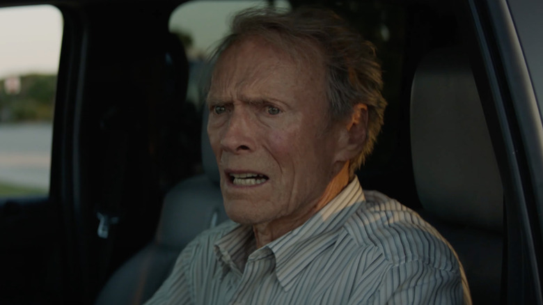 Clint Eastwood as Earl Stone breaks down in a car in The Mule