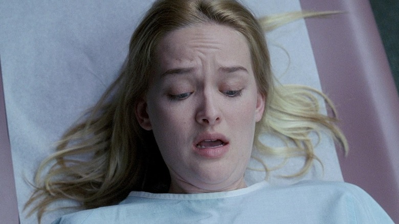 Dawn nervously looking down at her body at the gynecologist's office in Teeth (2007)