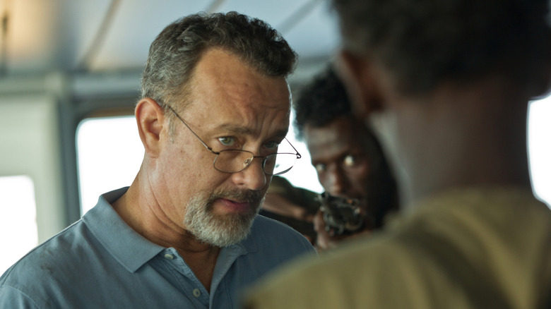 Captain Phillips is confronted by Somali pirates