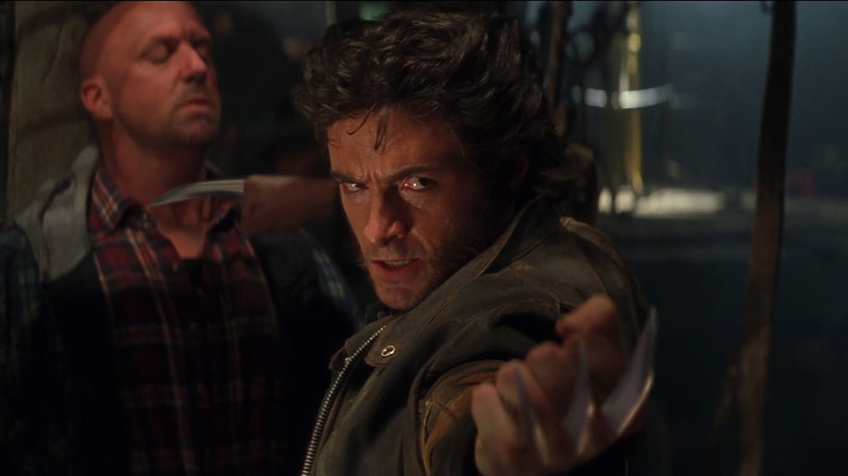 Wolverine drawing claws on people in a bar in X-Men