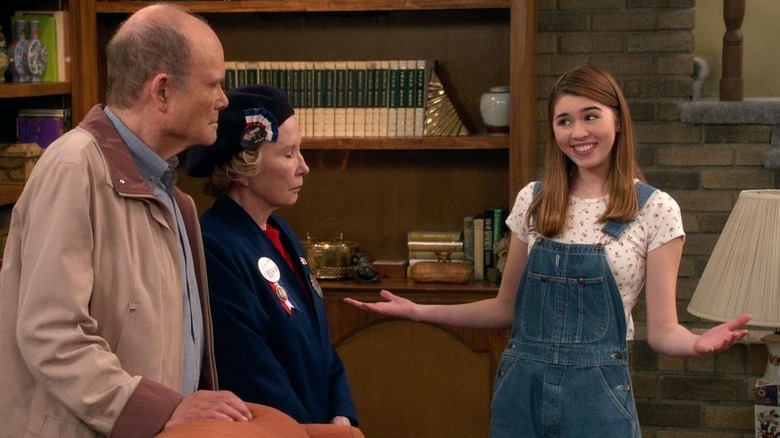 Callie Haverda's Leia Forman smiling at Kurtwood Smith's Red and Debra Jo Rupp's Kitty in That '90s Show