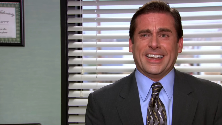 Steve Carell as Michael Scott laughing in The Office