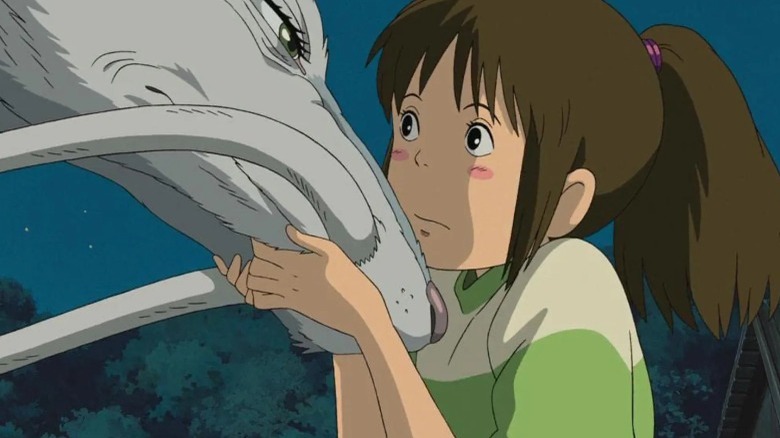 Chihiro holds Haku