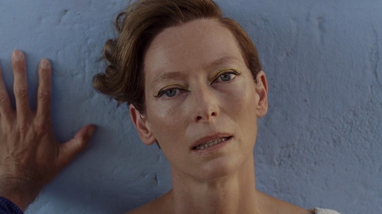 Tilda Swinton's Marianne against a wall in A Bigger Splash