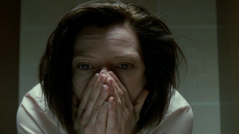 Tilda Swinton's Karen Crowder hides in bathroom stall in Michael Clayton