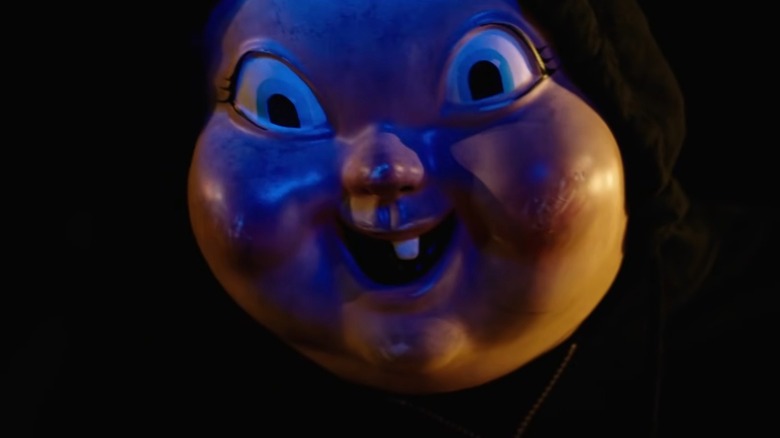 A closeup of the baby face killer's mask from Happy Death Day