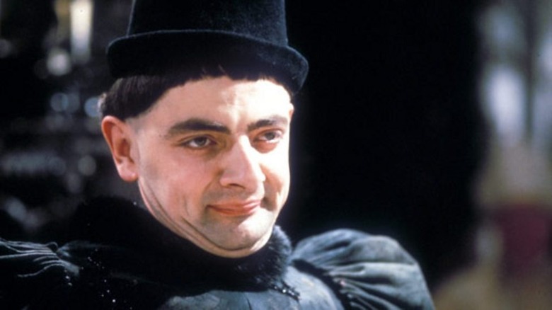 Blackadder Edmund in a black Edwardian costume