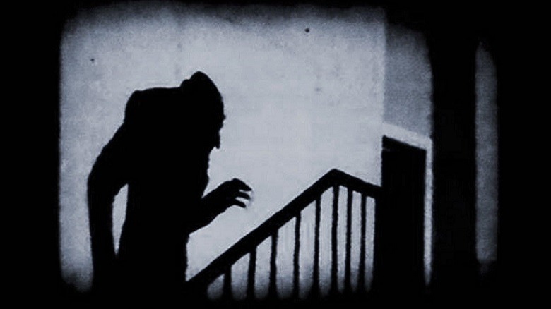 Count Orlok ascends the stairs in shadow